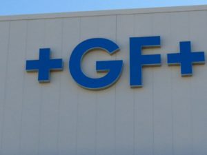 Picture of blue channel letters of +GF+ on the side of a building.
