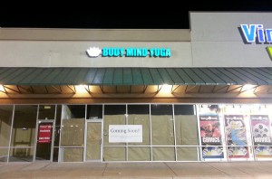 Body Mind Yoga sign by Electremedia at night.