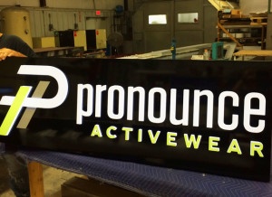 Push-thru acrylic face cabinet sign for Pronounce Activewear.